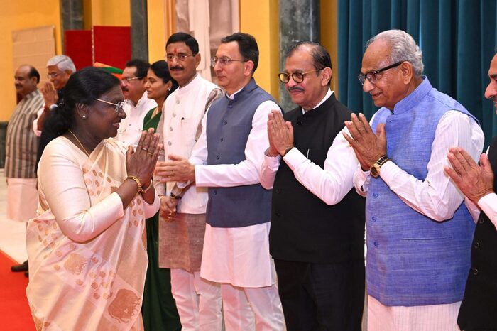 President Droupadi Murmu greeting a line of senior officials with folded hands
