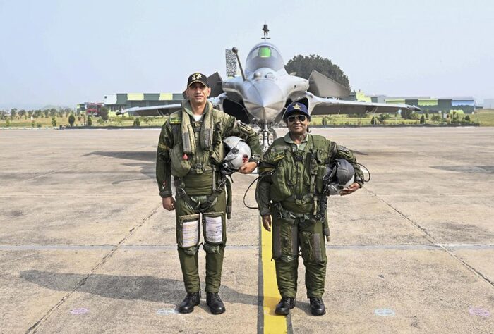 President Droupadi Murmu in a flight suit with the pilot in front of a Rafale fighter aircraft at Ambala